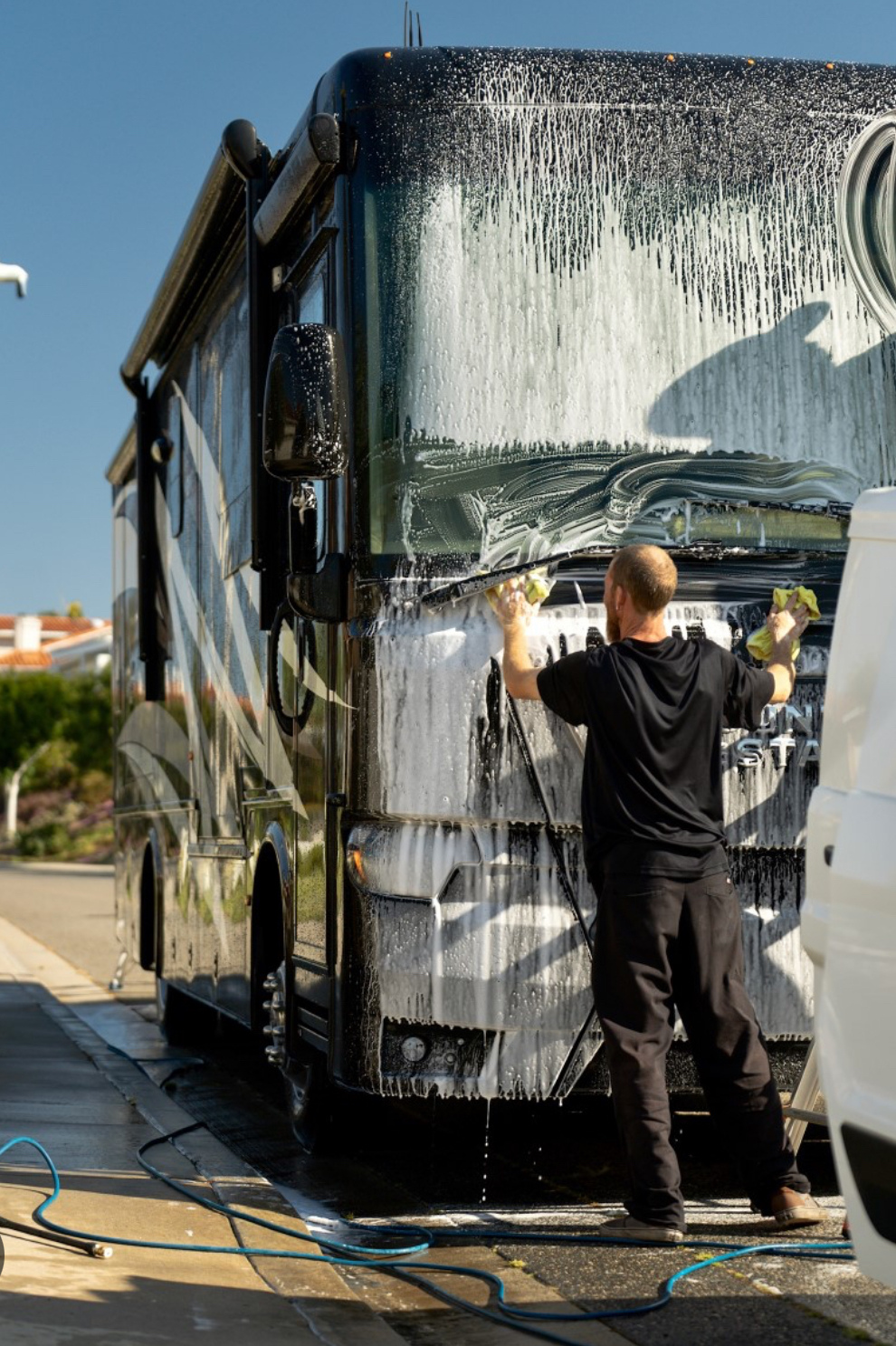 man washing rv